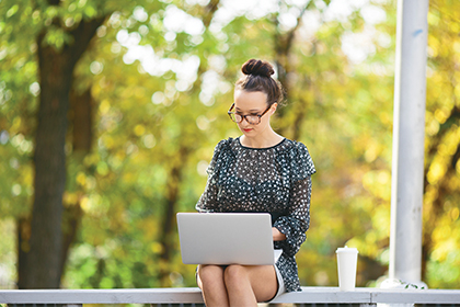 Women on her computer at the Employee Campus