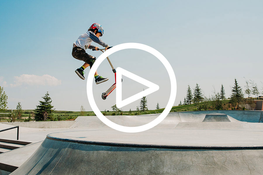 Boy on scooter in skate park in Calgary