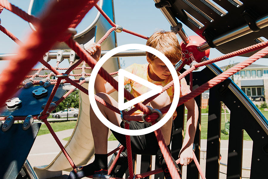 Playing on playground equipment at the park